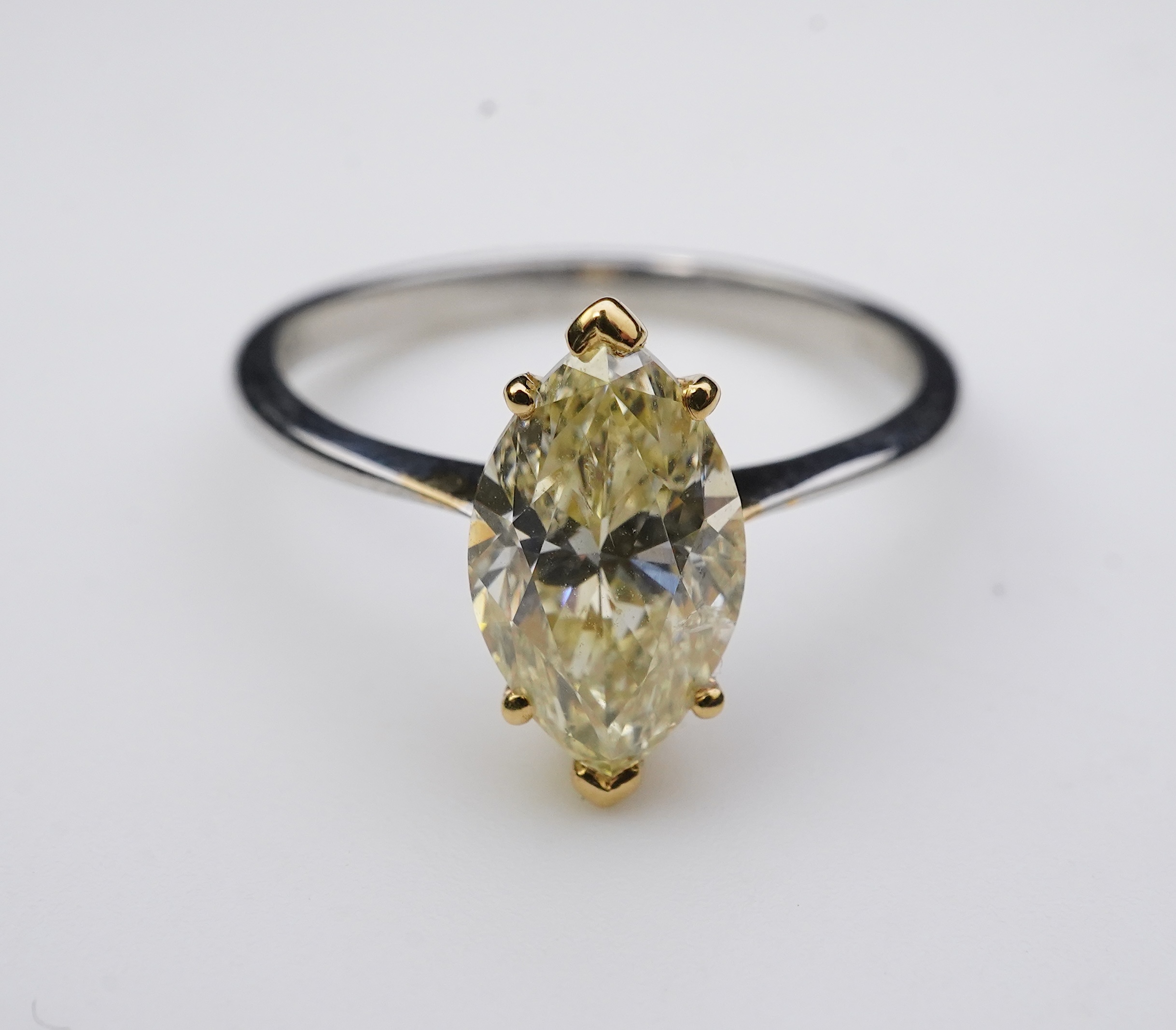 A yellow diamond solitaire ring